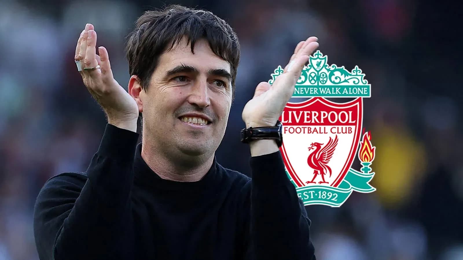 Coach applauding with Liverpool logo in background Coach applauding with Liverpool logo in background