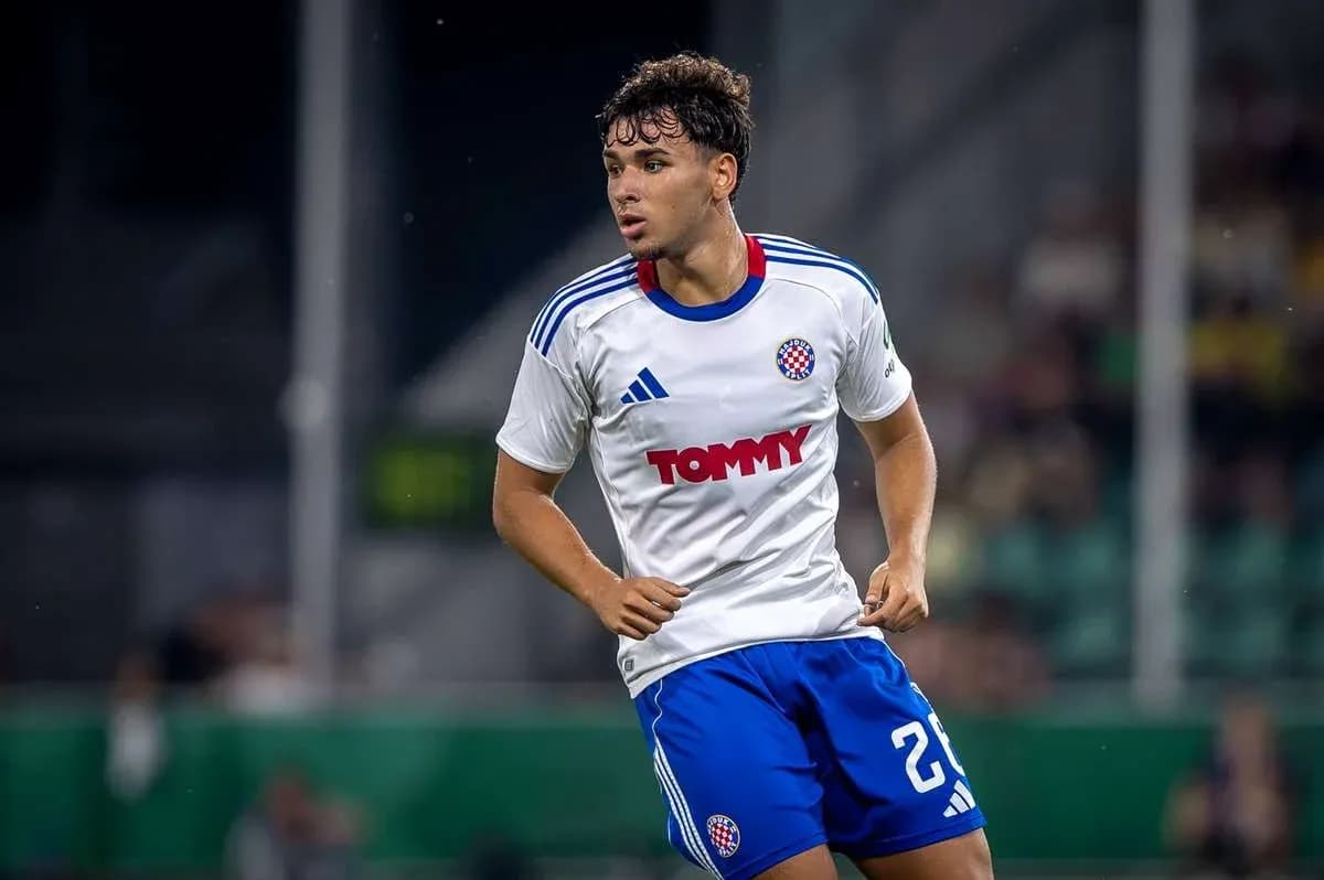 Player wearing white and blue kit during match Player wearing white and blue kit during match