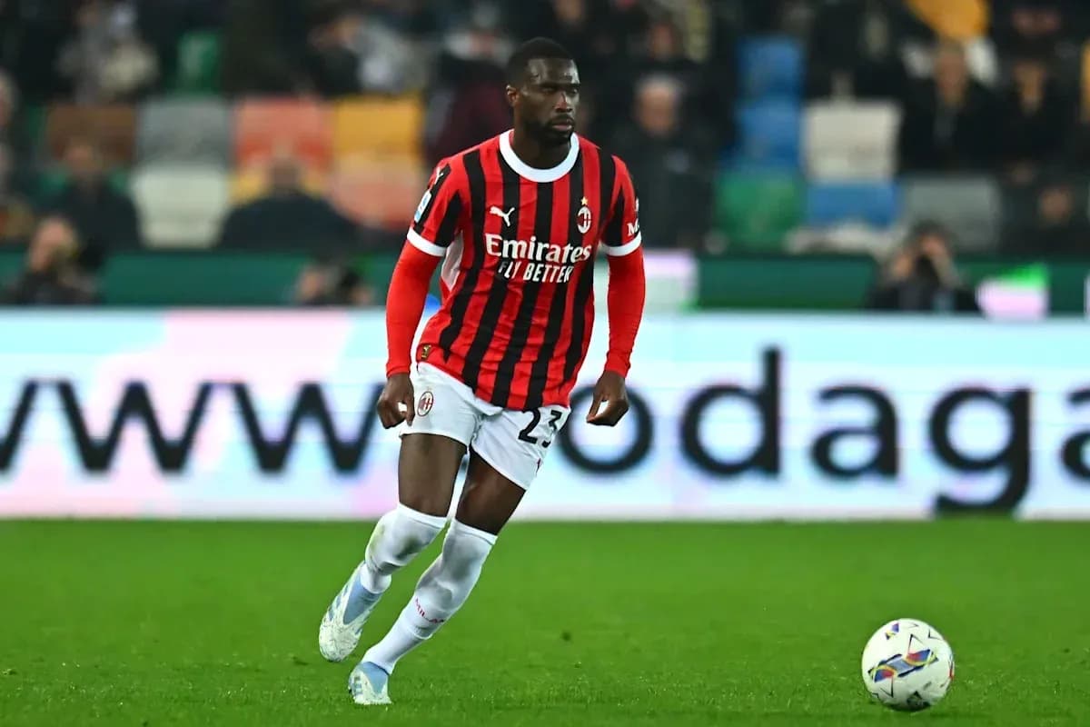 Player in AC Milan kit running with ball Player in AC Milan kit running with ball