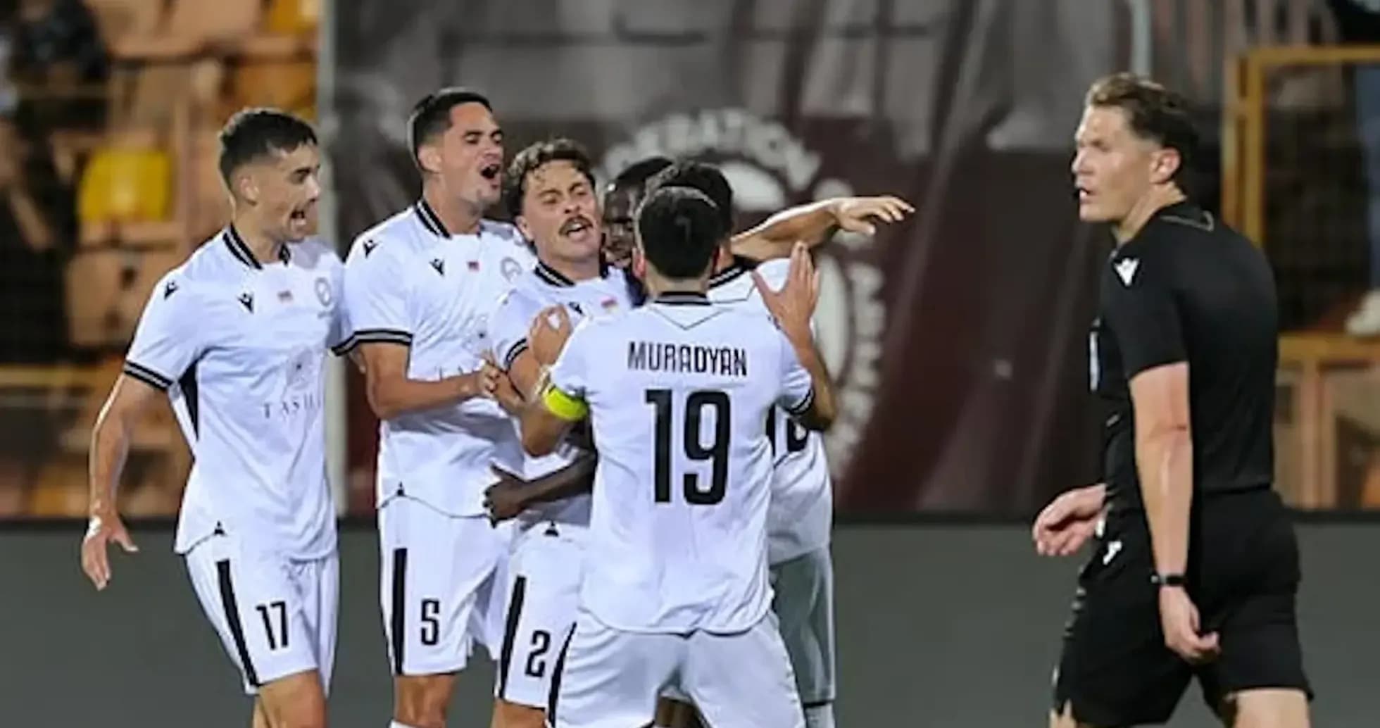 Players celebrating a goal in UEFA match Players celebrating a goal in UEFA match