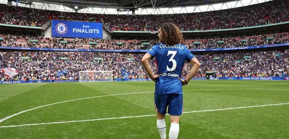 Player in Chelsea kit walking on Wembley pitch Player in Chelsea kit walking on Wembley pitch