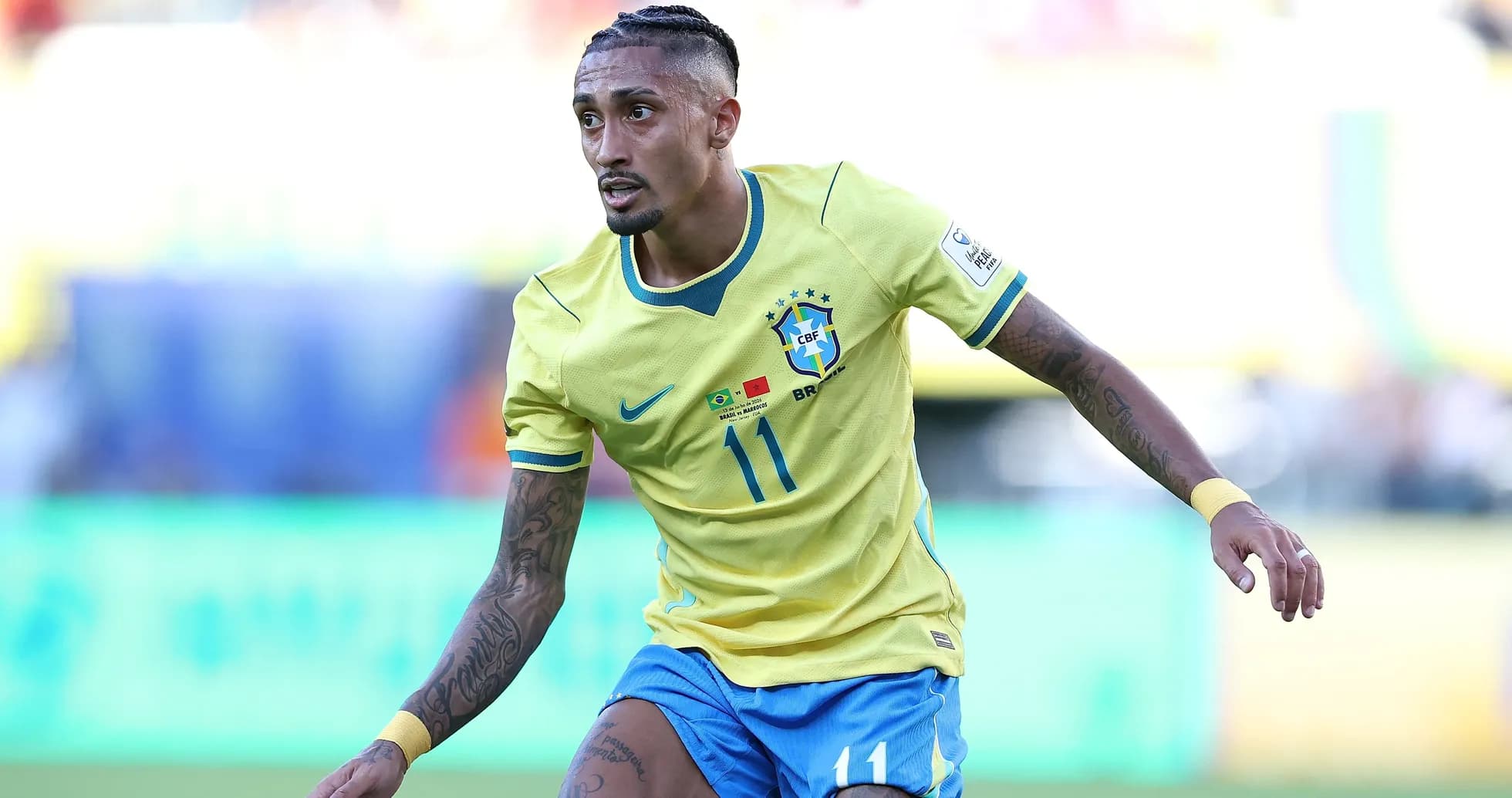 Player in Brazil jersey running on the field Player in Brazil jersey running on the field