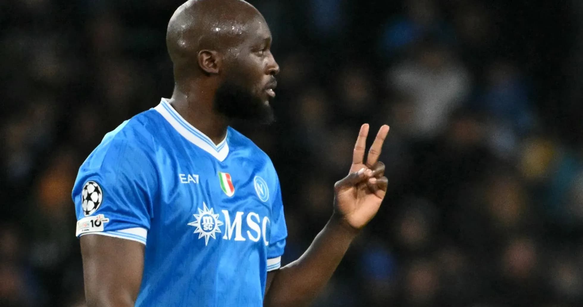 Player signaling during a match in blue jersey Player signaling during a match in blue jersey