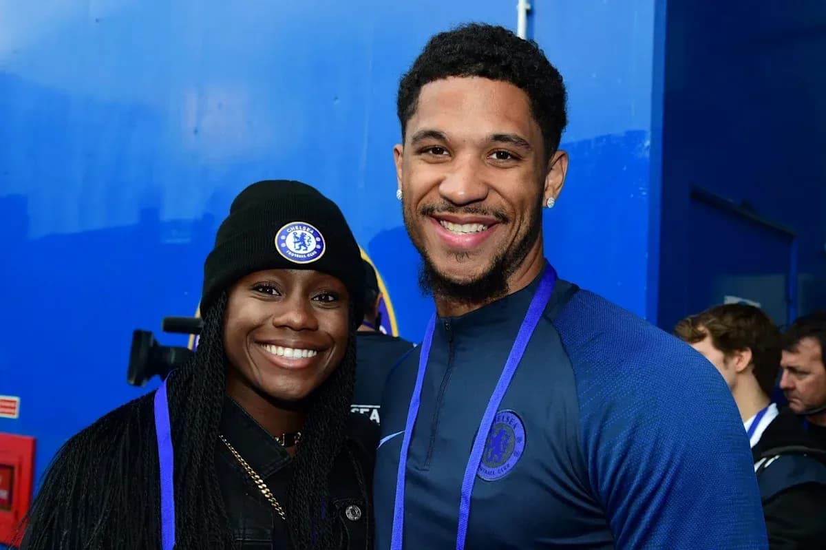 Two Chelsea FC fans posing together, smiling Two Chelsea FC fans posing together, smiling