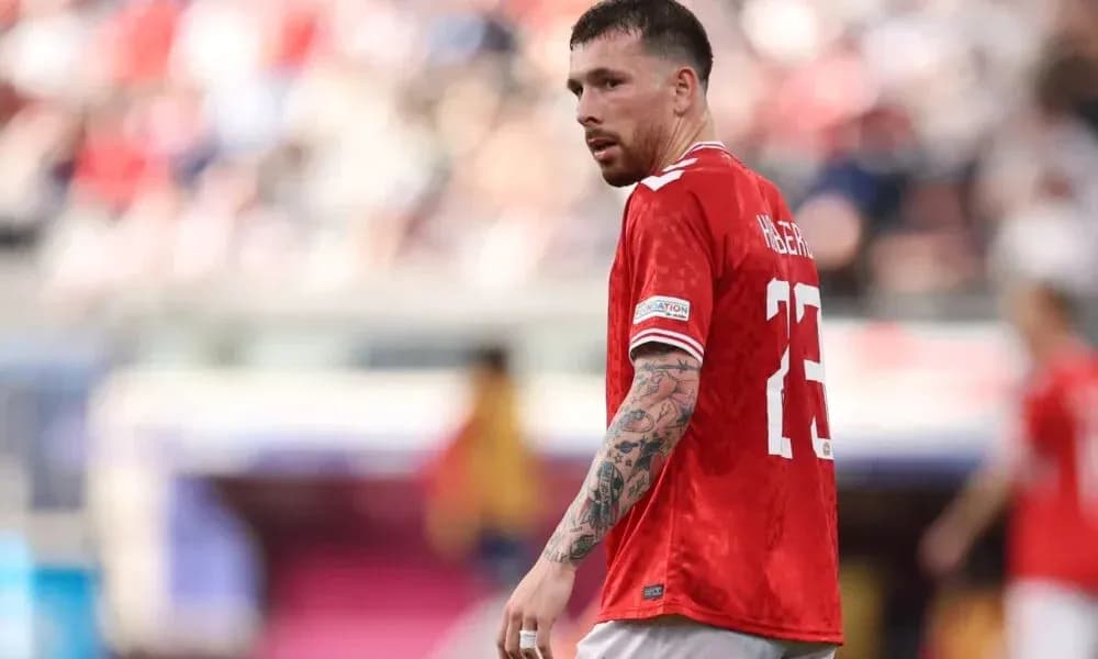Player wearing red jersey during football match Player wearing red jersey during football match