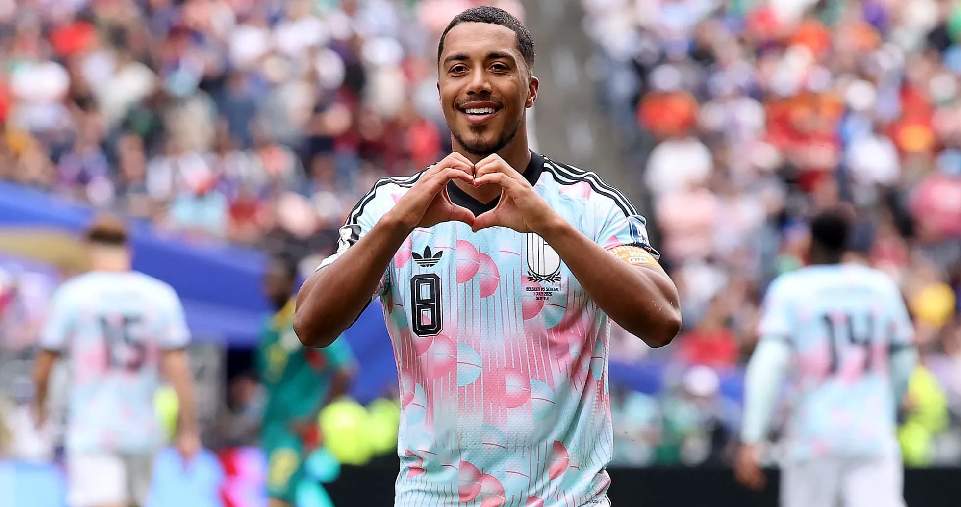 Player making heart gesture after scoring goal Player making heart gesture after scoring goal