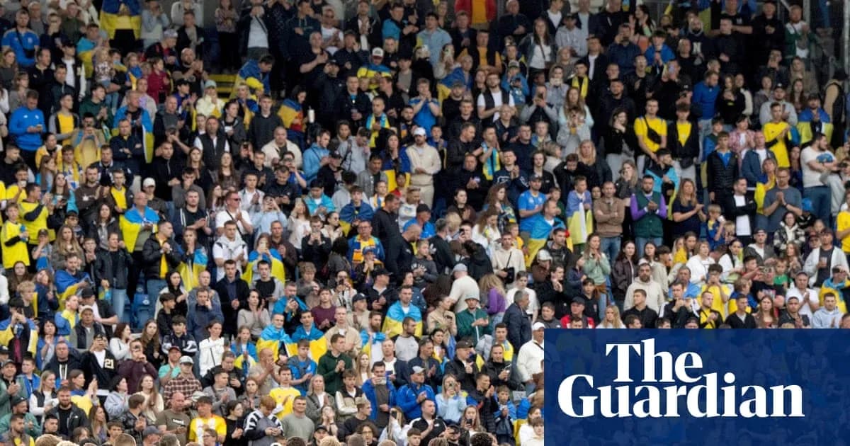 Crowd of fans in stadium cheering during match Crowd of fans in stadium cheering during match
