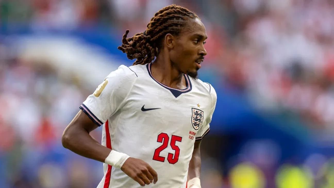 Player in England kit running on the field Player in England kit running on the field
