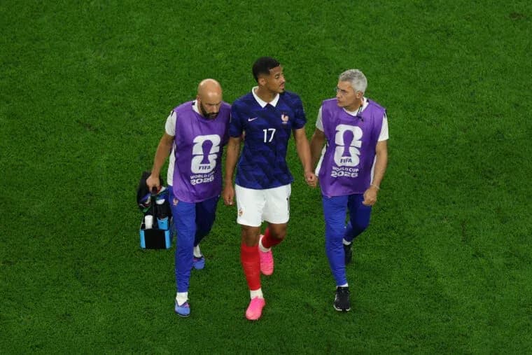 Player being assisted off the field by staff Player being assisted off the field by staff