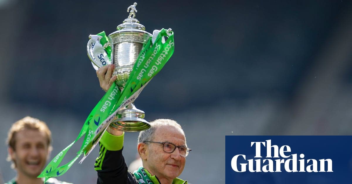 Coach holding trophy with celebratory ribbon Coach holding trophy with celebratory ribbon