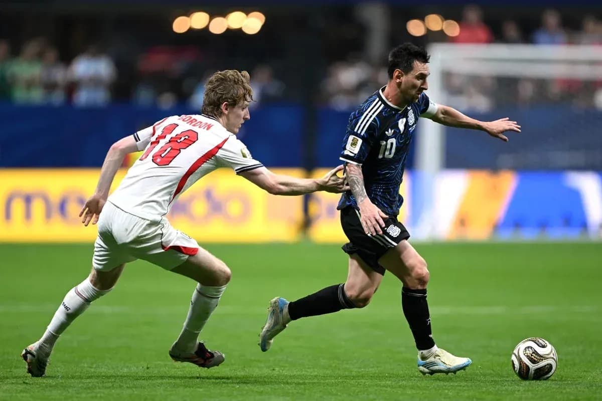 Player in blue jersey evading opponent in white jersey Player in blue jersey evading opponent in white jersey