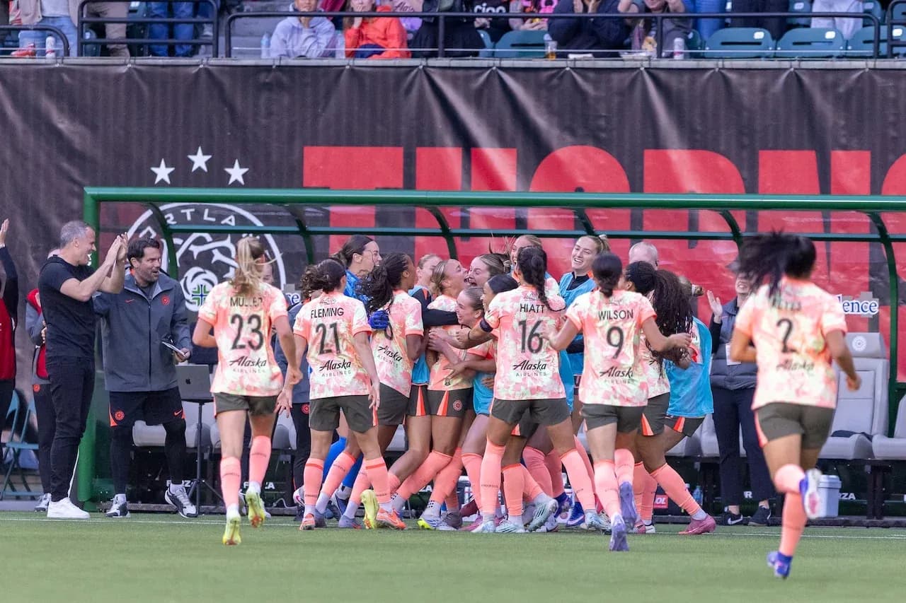 Portland Thorns players celebrating a goal Portland Thorns players celebrating a goal