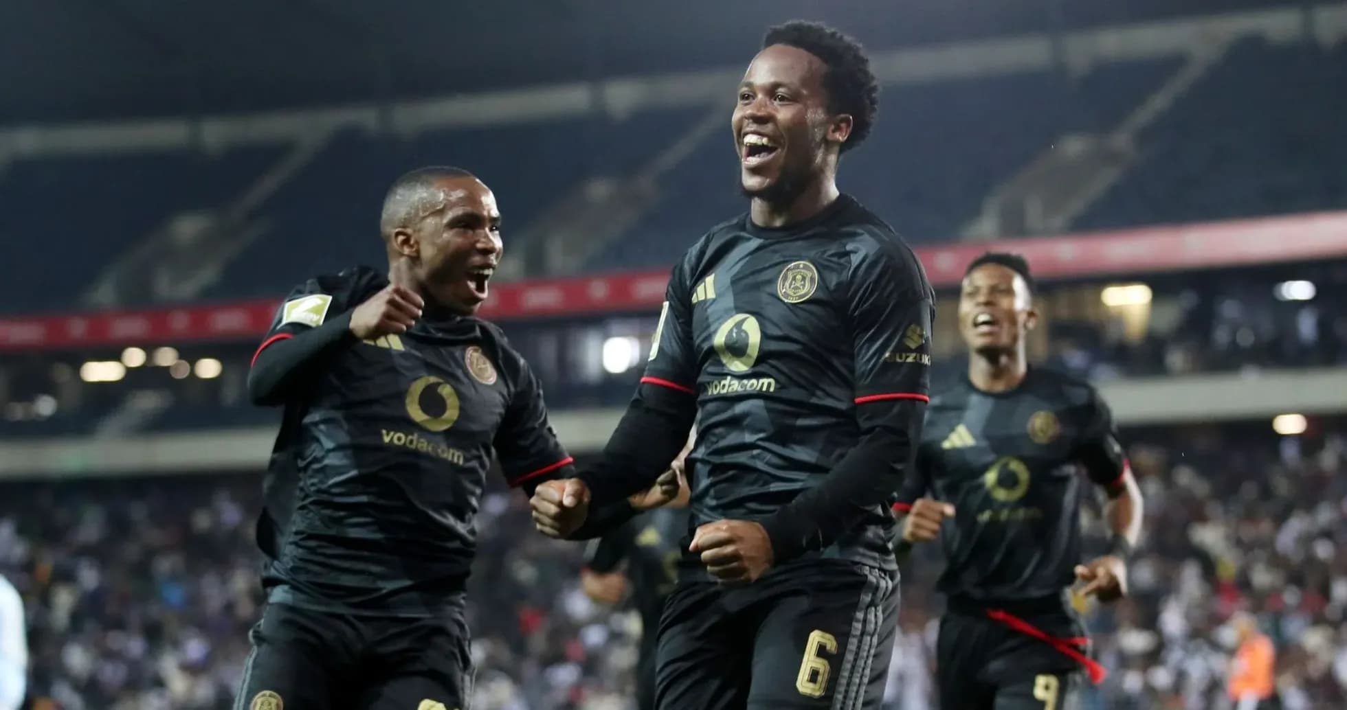 Players celebrating a goal during a match Players celebrating a goal during a match
