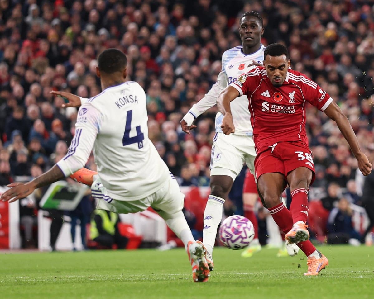 Aston Villa player tackling Liverpool forward Aston Villa player tackling Liverpool forward