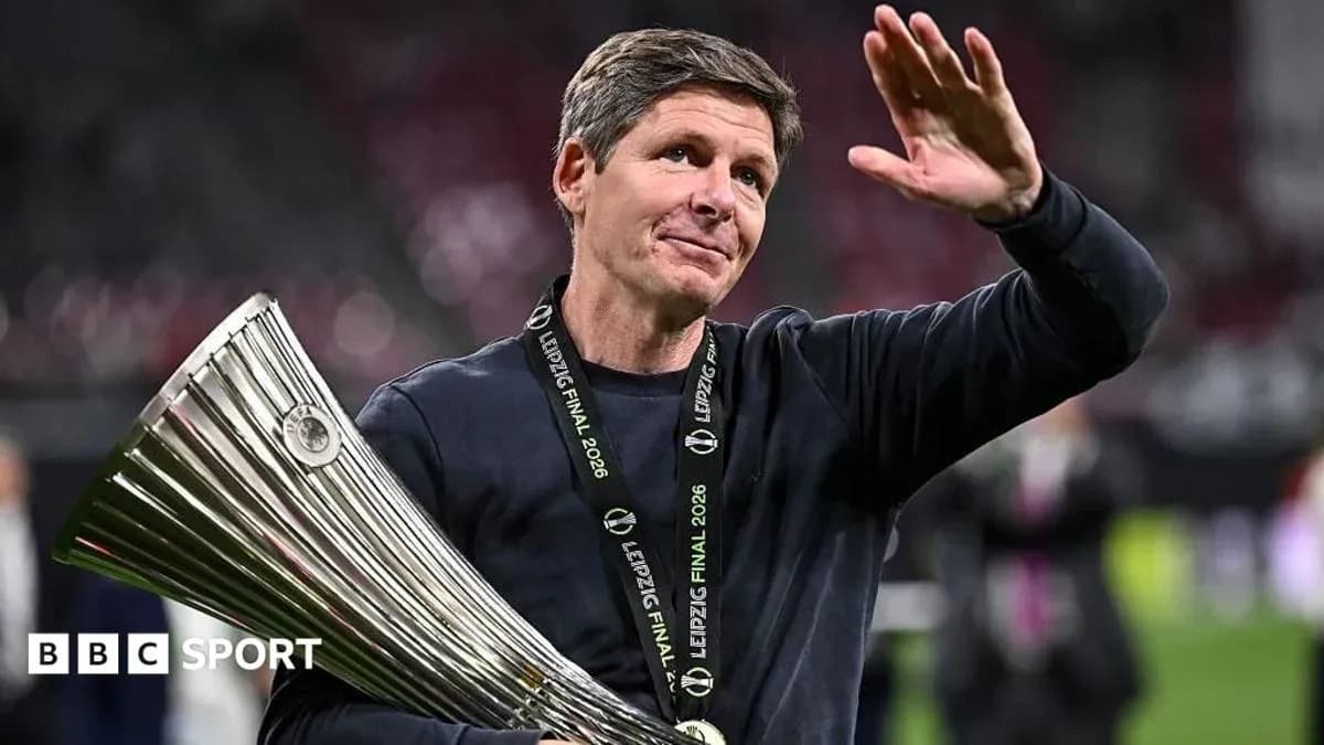 Coach celebrating with trophy after match victory Coach celebrating with trophy after match victory