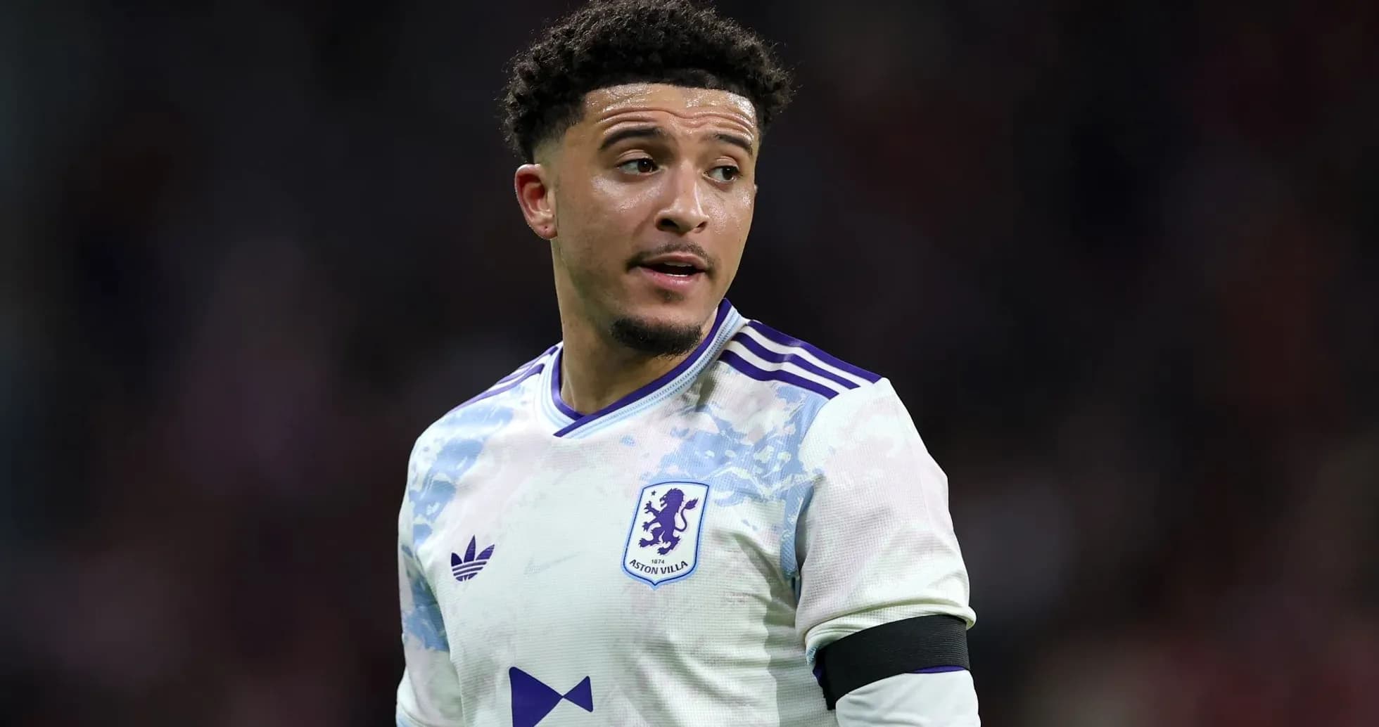 Aston Villa player in white kit during match Aston Villa player in white kit during match