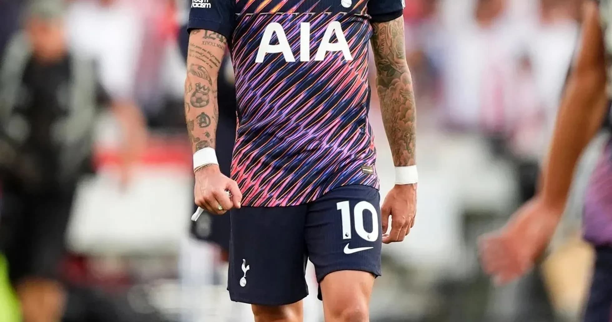 Player in Tottenham kit walking on the pitch Player in Tottenham kit walking on the pitch