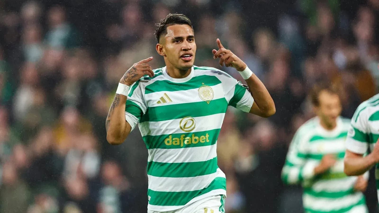 Player celebrating a goal in Celtic kit Player celebrating a goal in Celtic kit