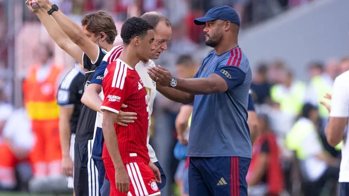 Coach discussing with player during match substitution Coach discussing with player during match substitution