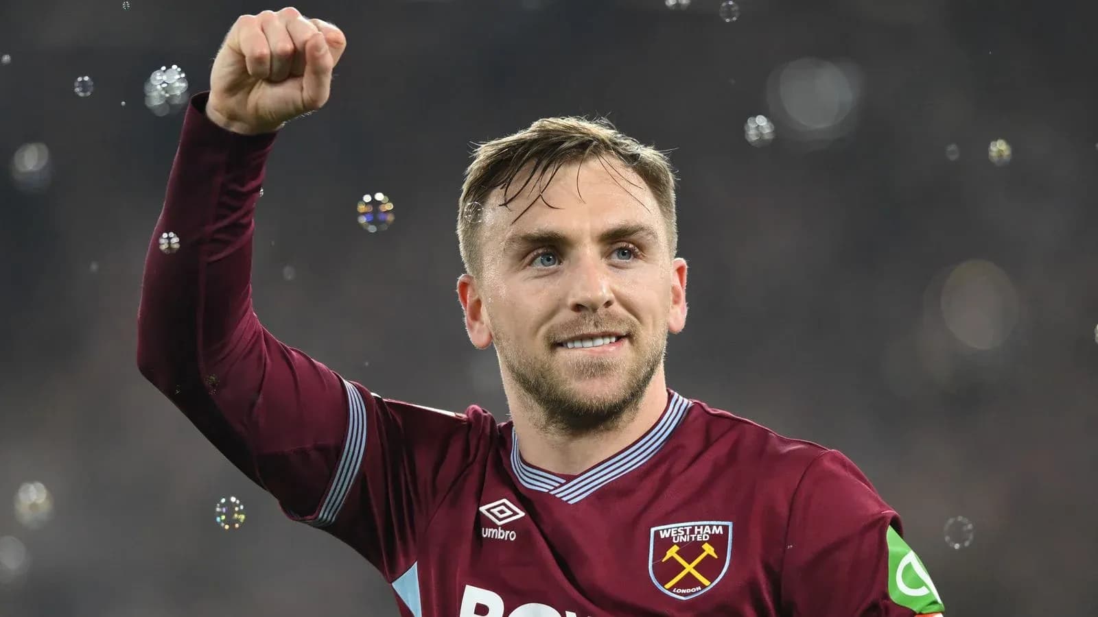 Player celebrating with raised fist at stadium Player celebrating with raised fist at stadium
