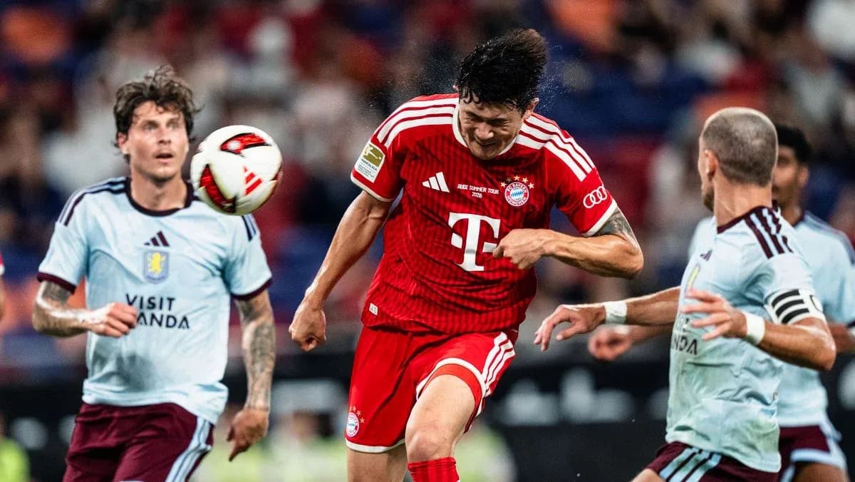 Player heading the ball during a match action Player heading the ball during a match action