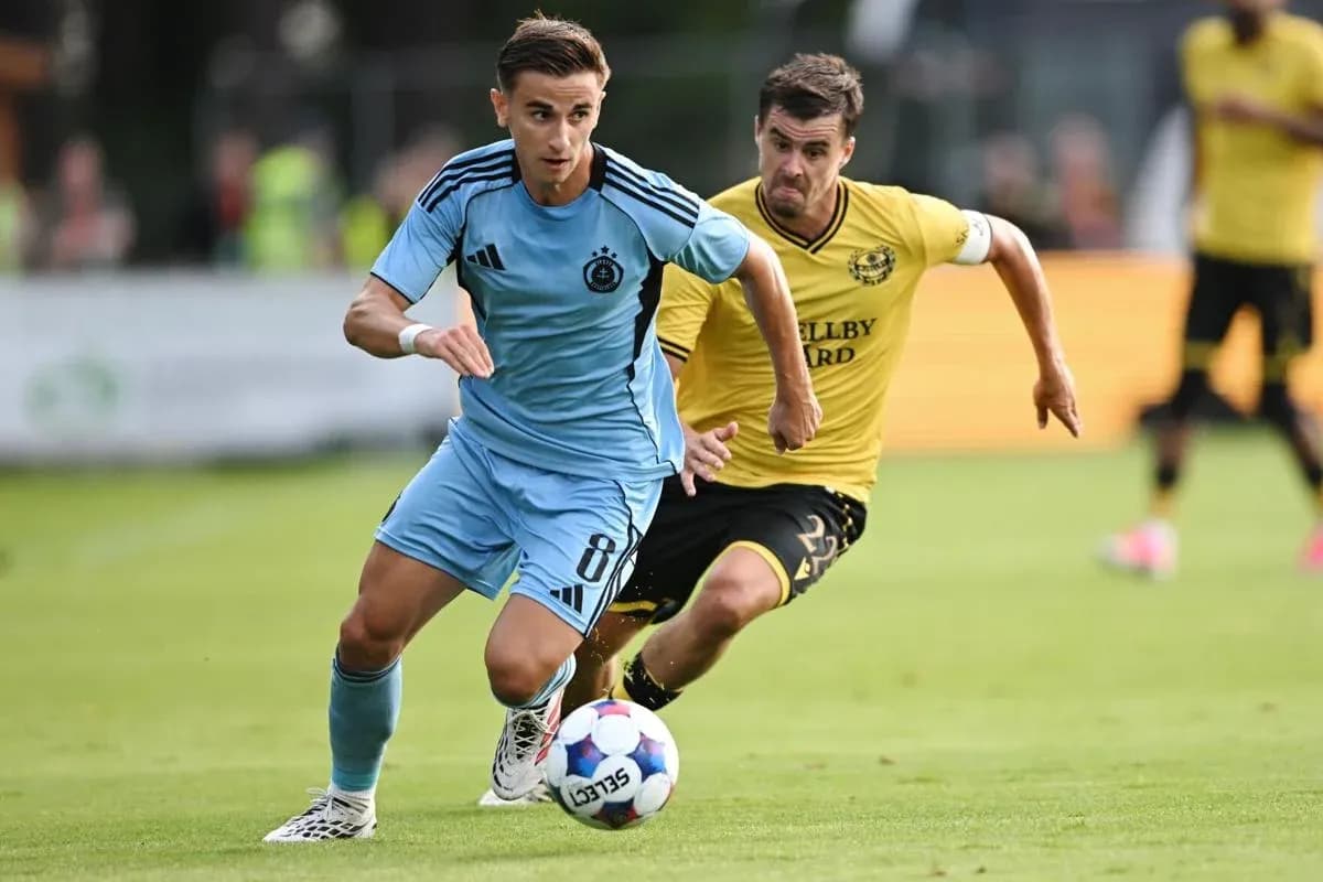 Player dribbling the ball in UEFA match Player dribbling the ball in UEFA match