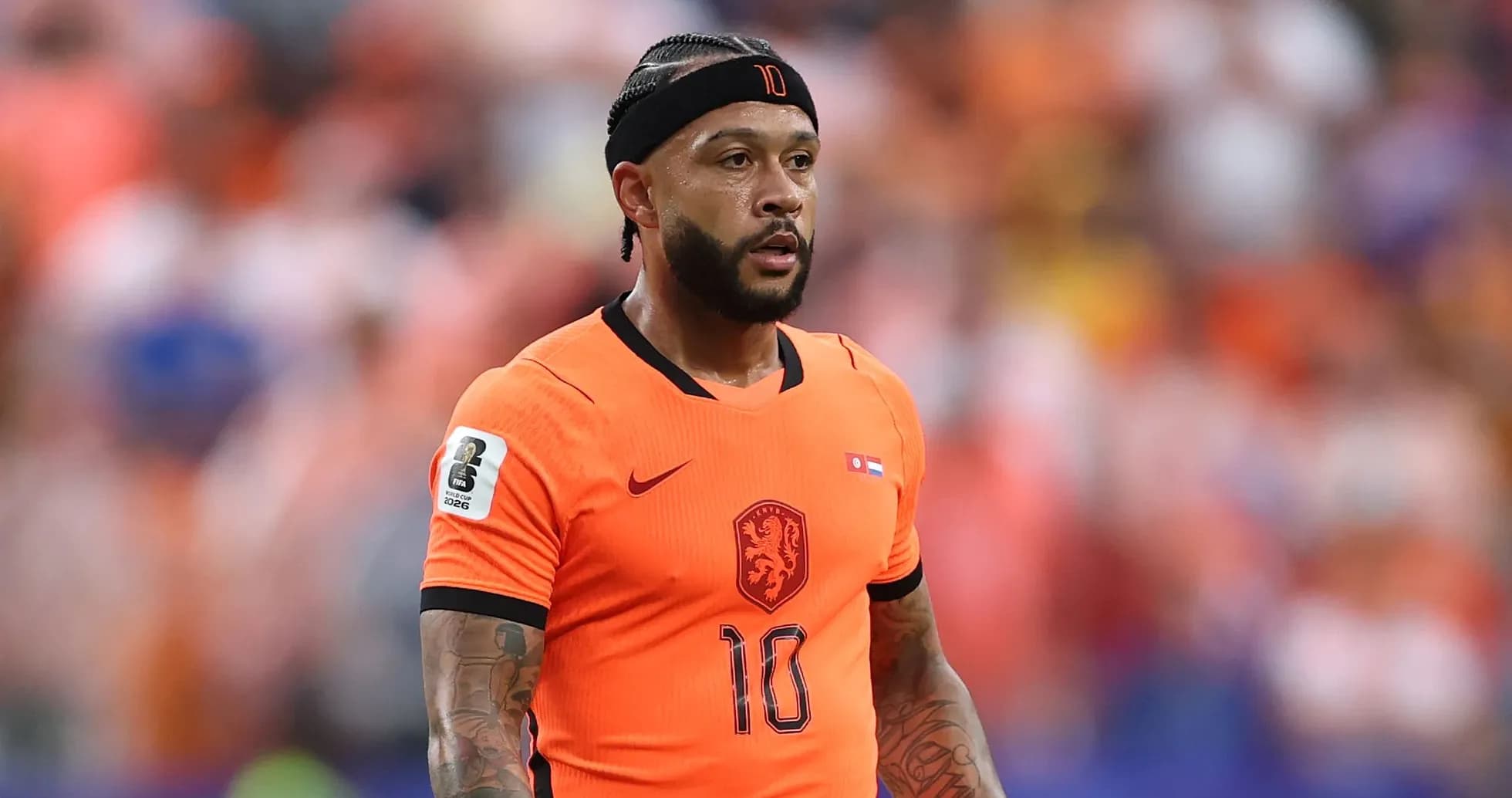 Player wearing orange jersey during a match Player wearing orange jersey during a match