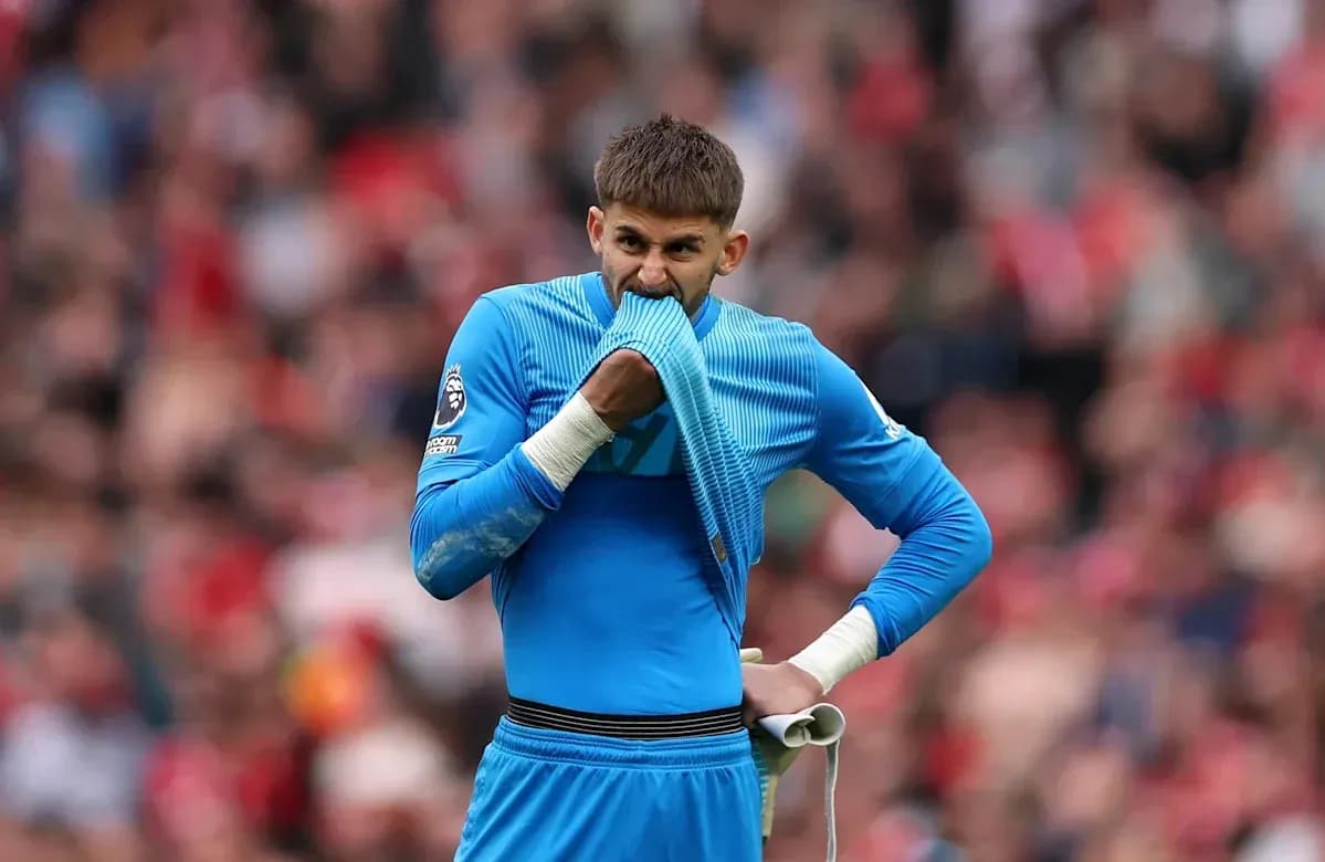 Goalkeeper holding jersey during match in stadium Goalkeeper holding jersey during match in stadium