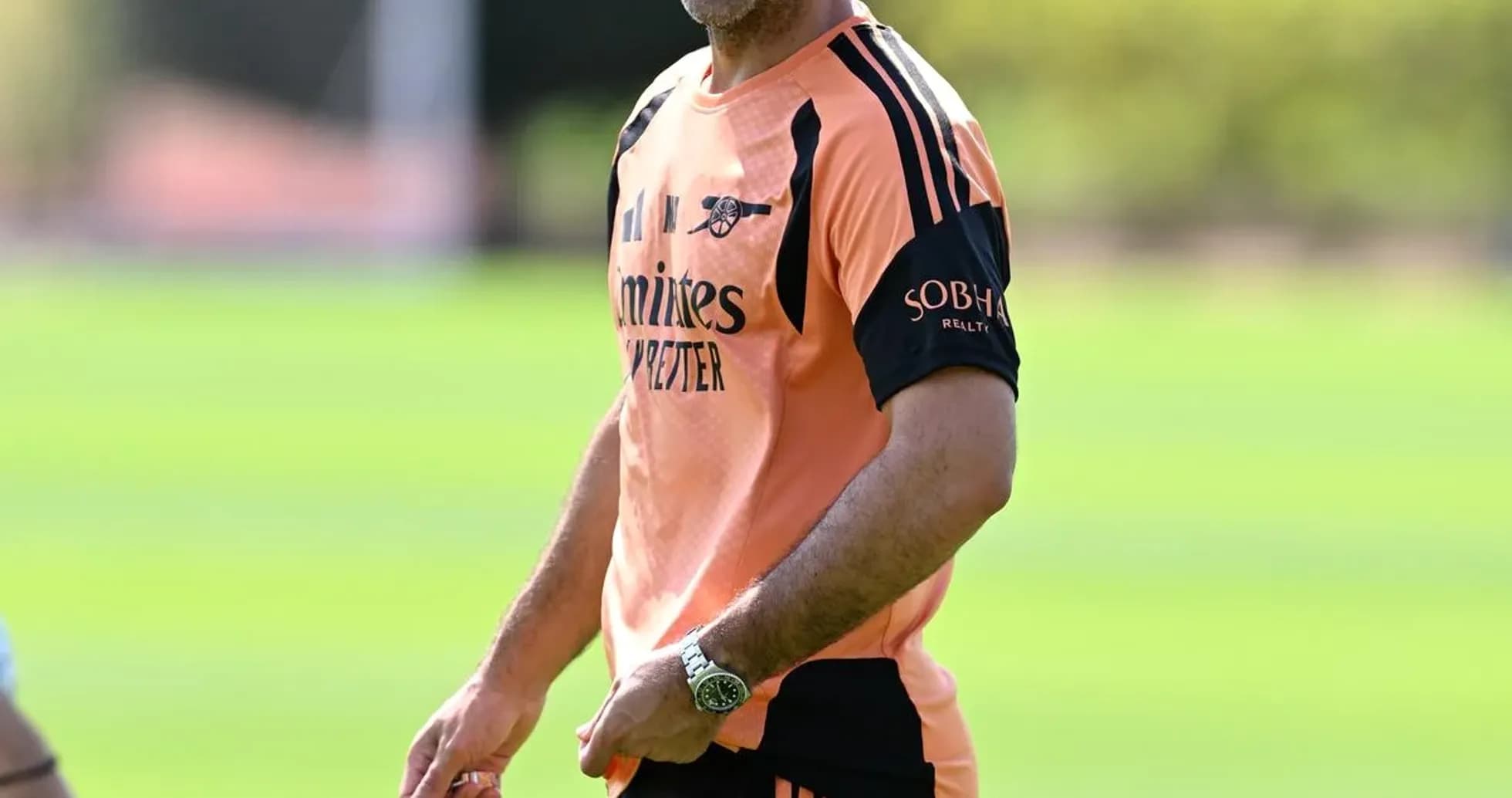 Coach smiling during training session on field Coach smiling during training session on field
