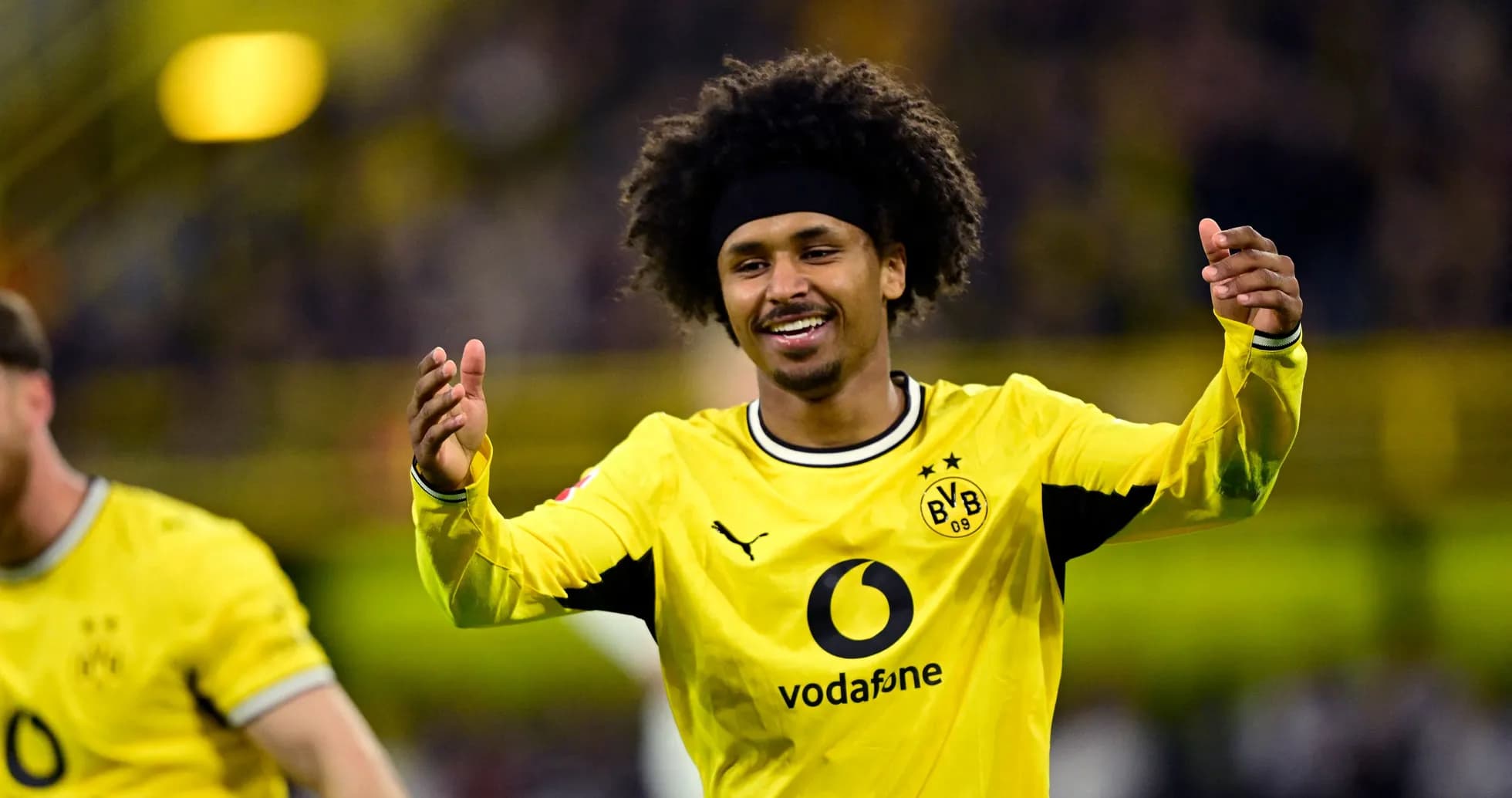 Borussia Dortmund player celebrating during a match Borussia Dortmund player celebrating during a match