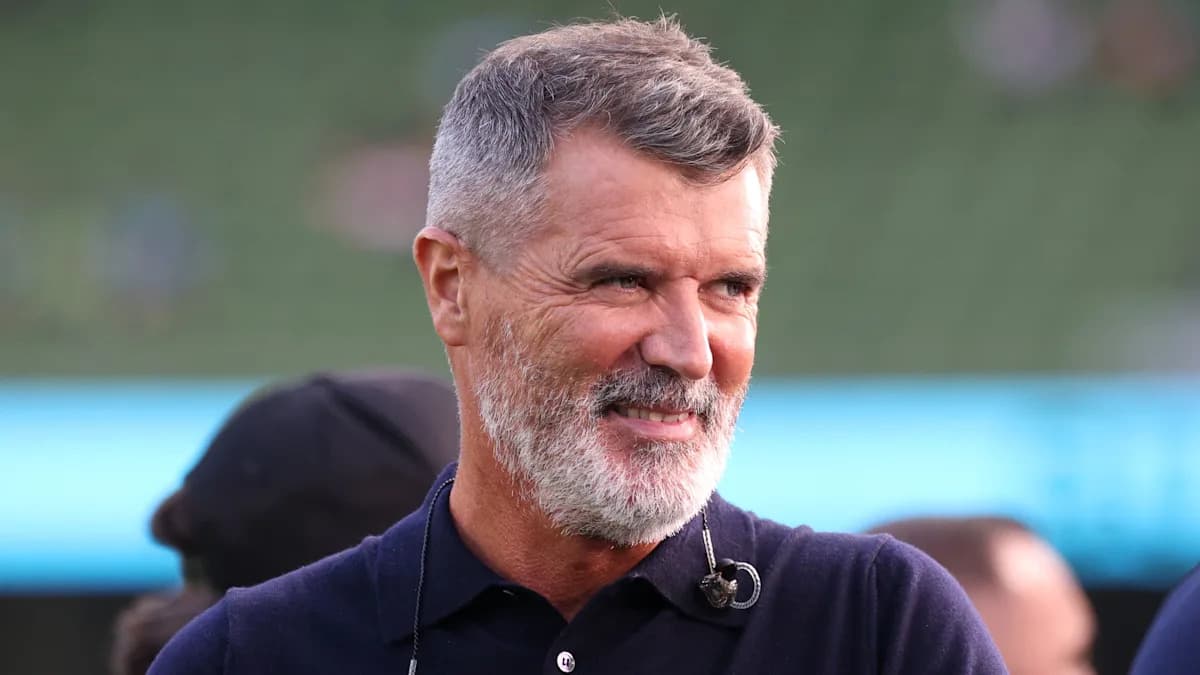 Man with gray beard smiling at event Man with gray beard smiling at event