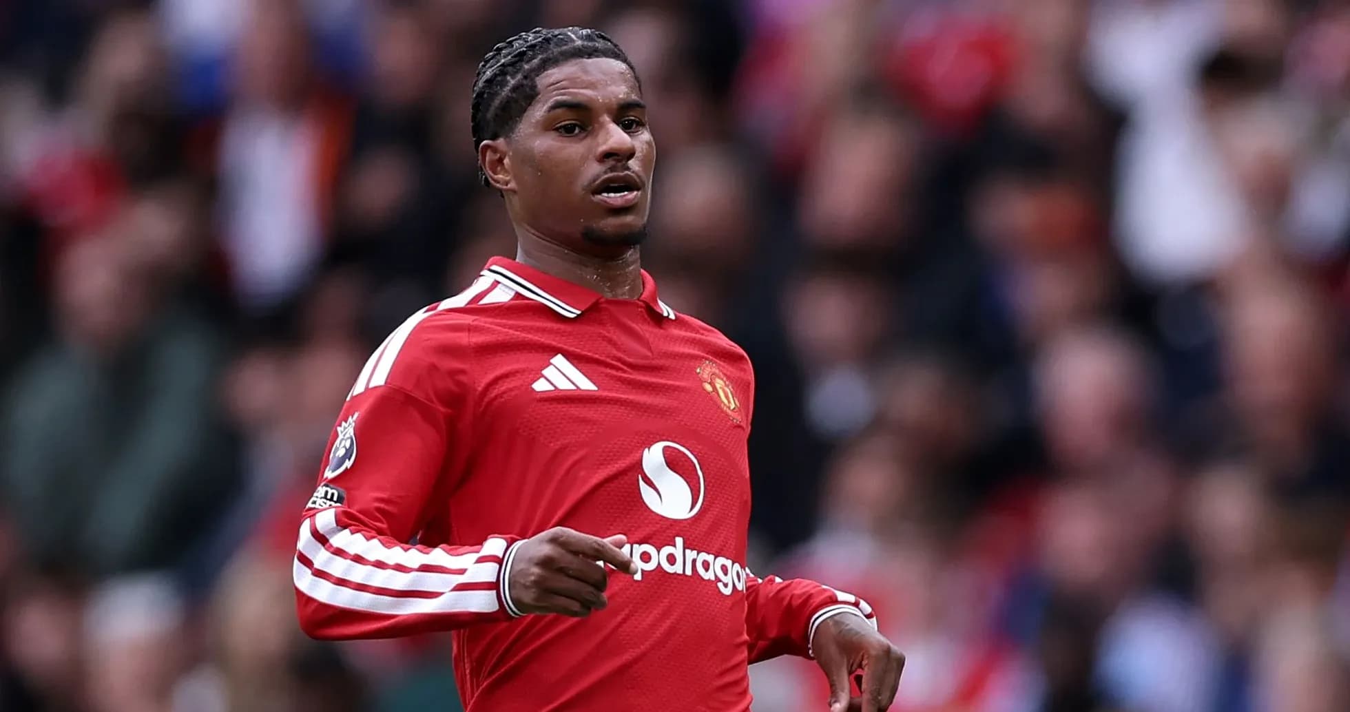 Player in Manchester United jersey on the field Player in Manchester United jersey on the field