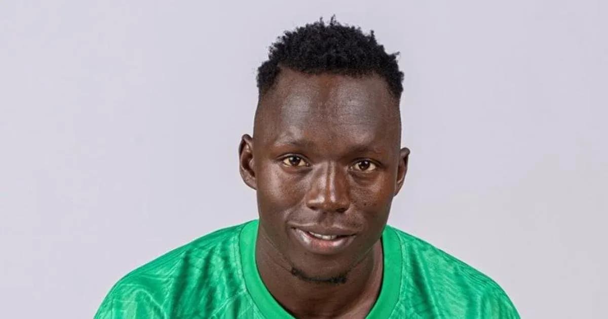 Football player wearing green jersey posing for photo Football player wearing green jersey posing for photo