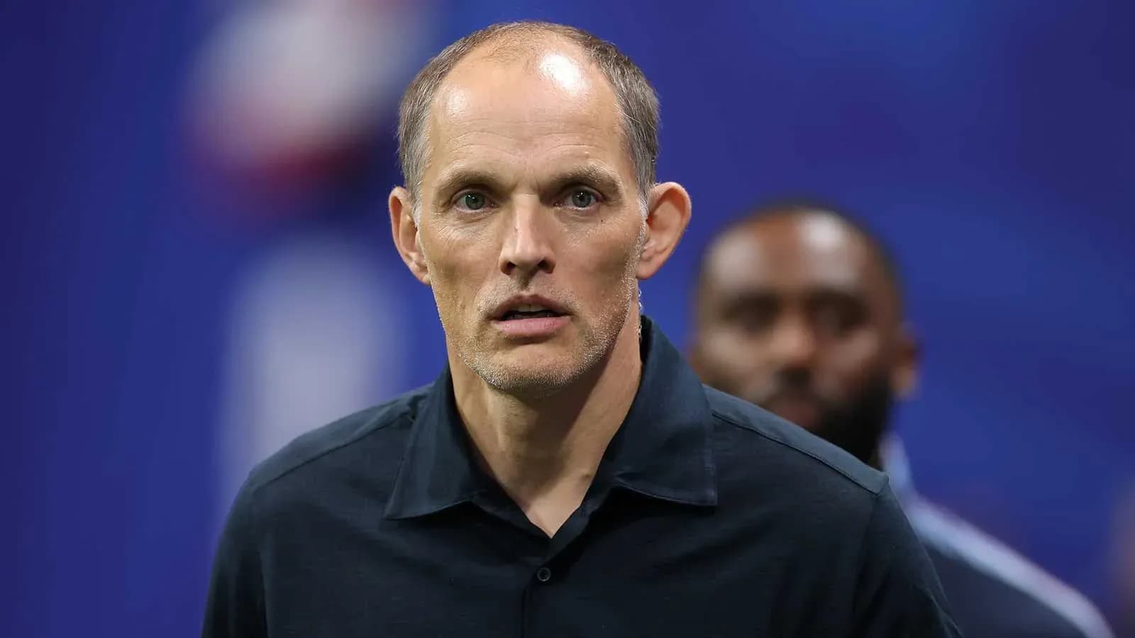 Coach standing on the sidelines during match Coach standing on the sidelines during match