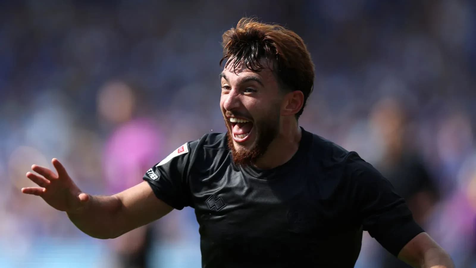 Player celebrating a goal during a match Player celebrating a goal during a match