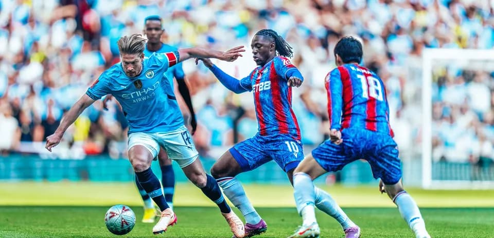 Manchester City player dribbling against Crystal Palace Manchester City player dribbling against Crystal Palace