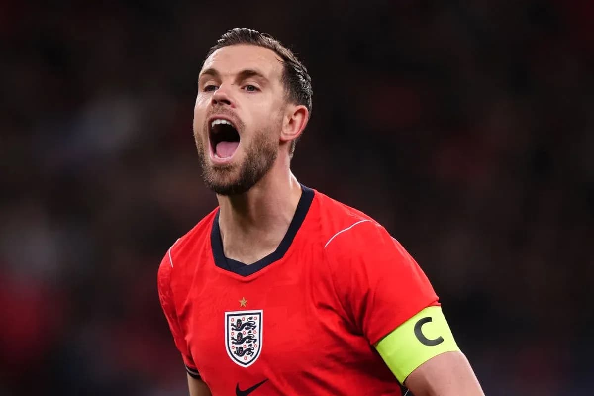 Player in red England jersey celebrating passionately Player in red England jersey celebrating passionately