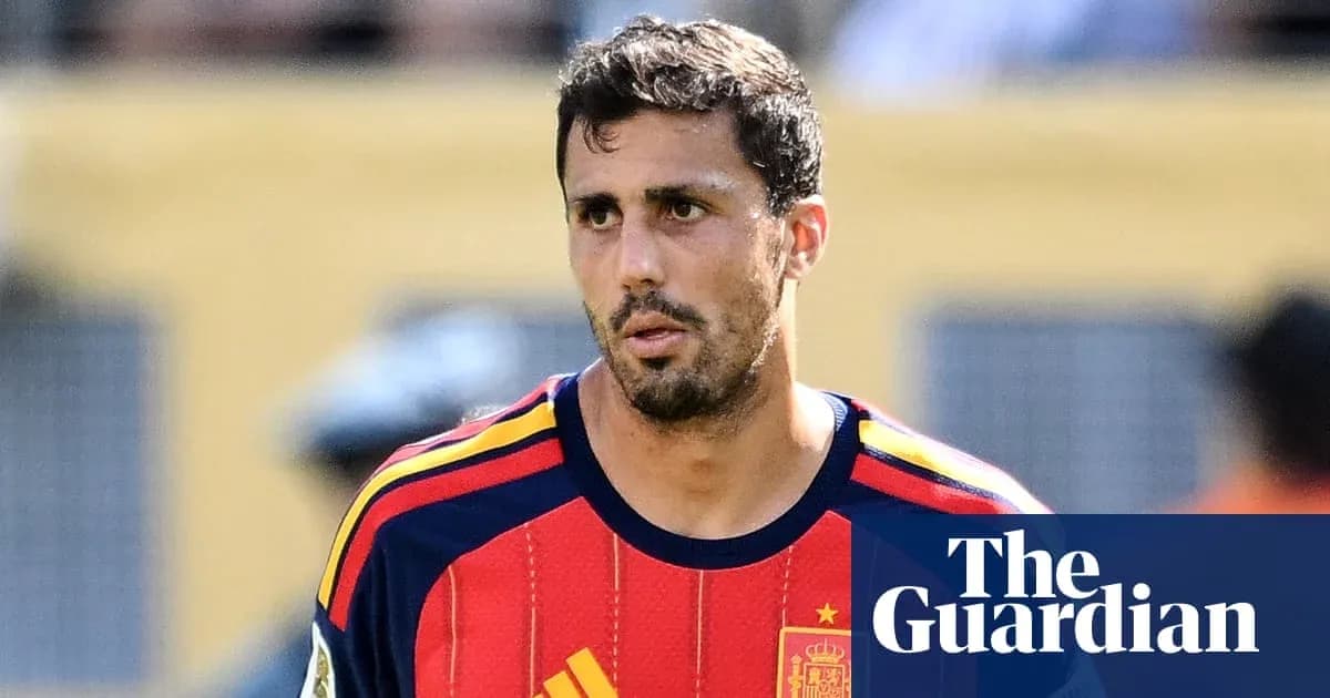 Player wearing Spain national team jersey on field Player wearing Spain national team jersey on field