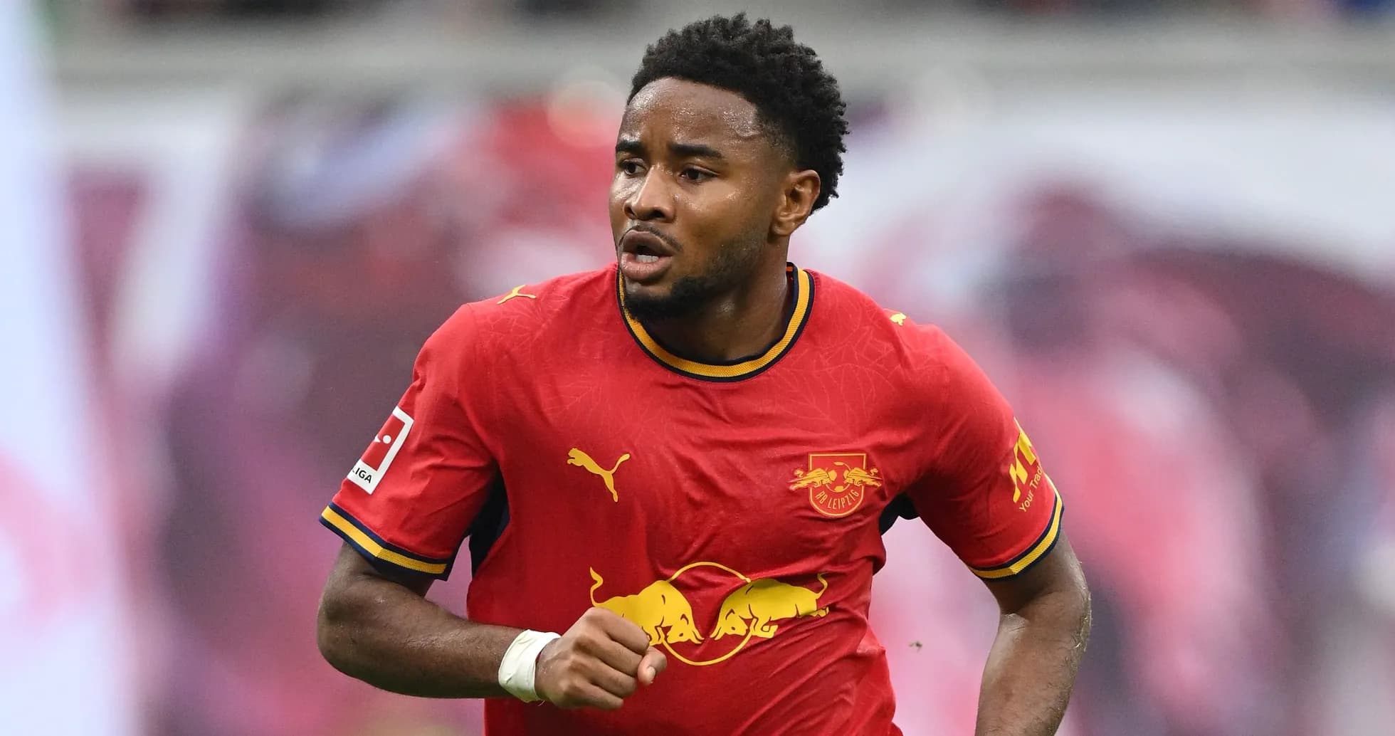 Player running in red RB Leipzig jersey during match Player running in red RB Leipzig jersey during match