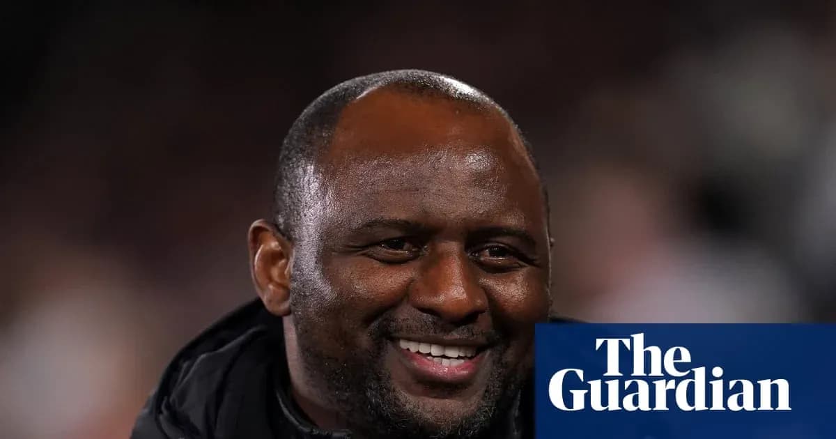 Coach smiling during match at stadium Coach smiling during match at stadium