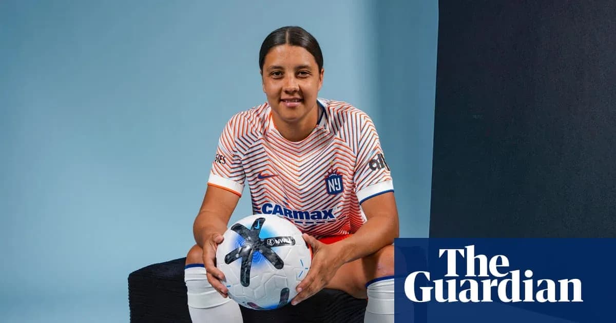 Player posing with soccer ball in studio Player posing with soccer ball in studio