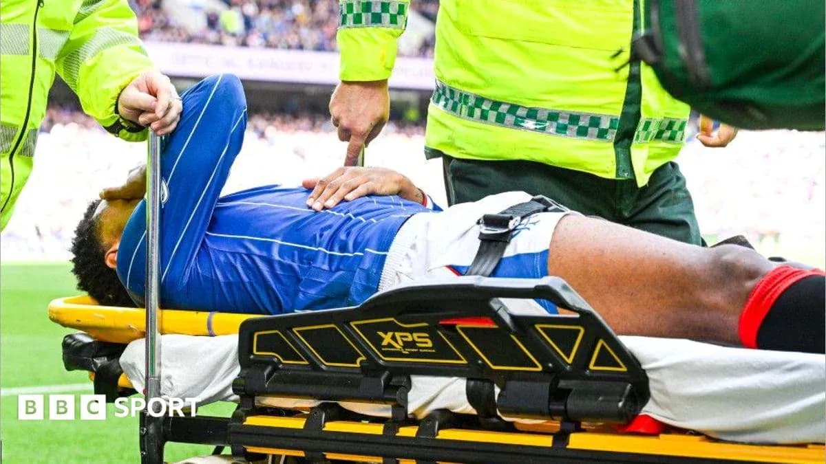 Player being stretchered off by medical staff Player being stretchered off by medical staff