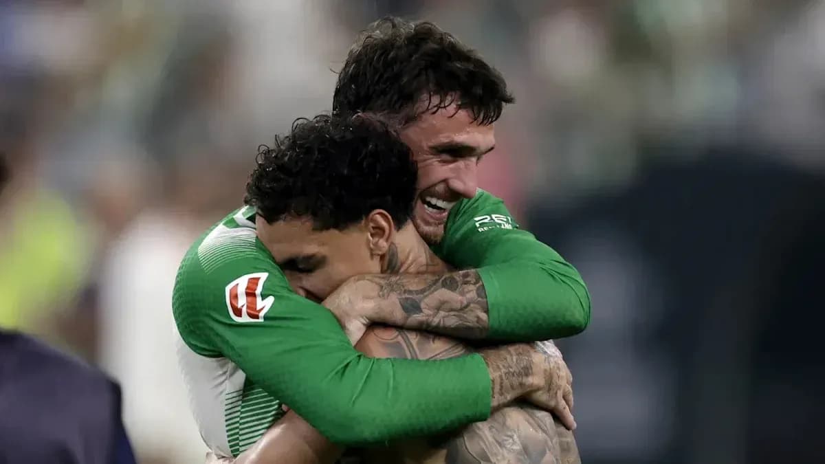 Players celebrating with an embrace after victory Players celebrating with an embrace after victory