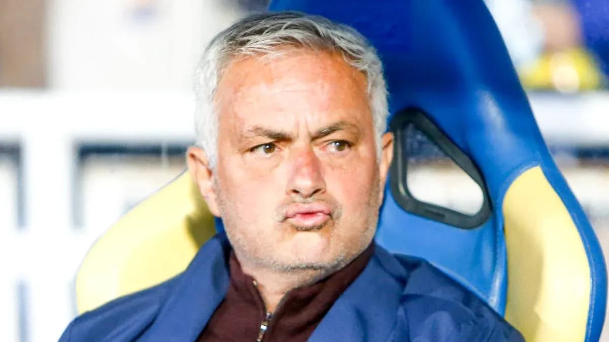 Coach sitting on bench during match Coach sitting on bench during match
