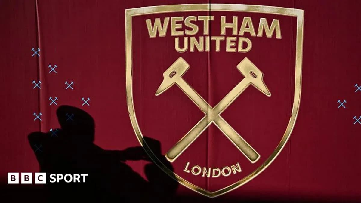 West Ham United club logo on red background West Ham United club logo on red background