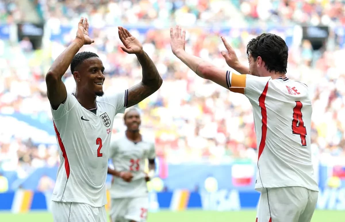 Two England players celebrating during a match Two England players celebrating during a match