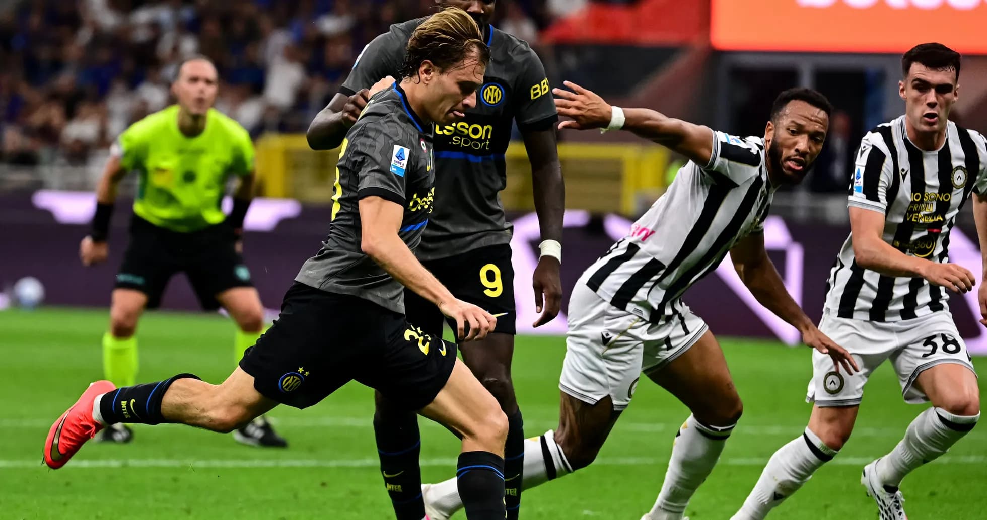 Player dribbling past opponents during Serie A match Player dribbling past opponents during Serie A match