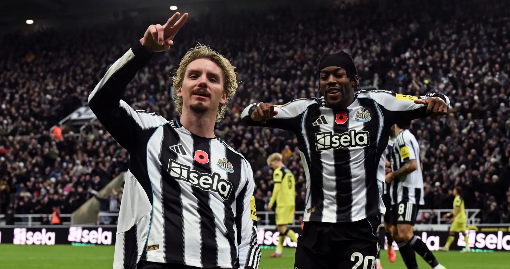 Newcastle players celebrating a goal during match Newcastle players celebrating a goal during match