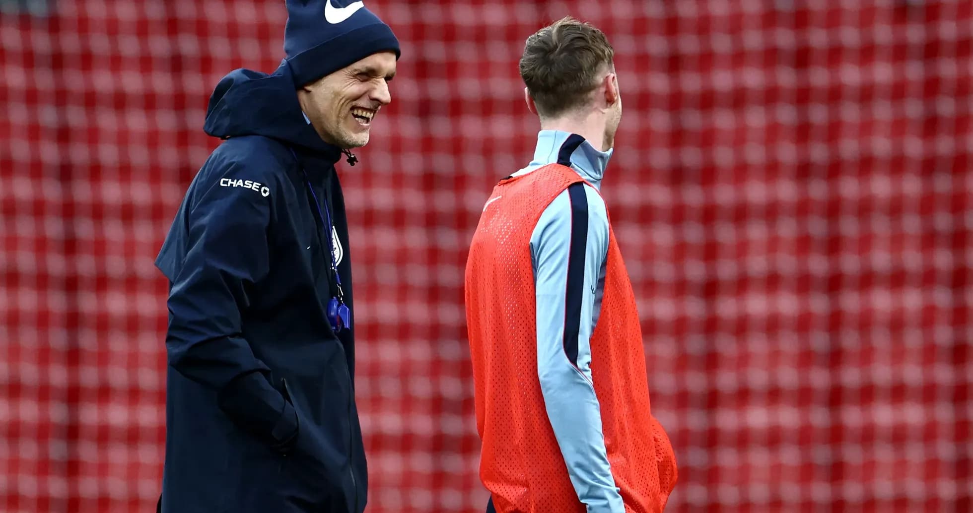 Coach and player laughing during training session Coach and player laughing during training session