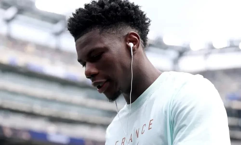 Player wearing earphones before the match Player wearing earphones before the match